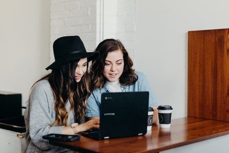 Team members high-fiving in office